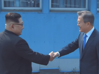 North Korea's Kim Jong-un shakes hands with South Korea's Moon Jae-in across the demarcation line separating their countries. 27 April 2018 (Image via Korea.net Youtube channel)