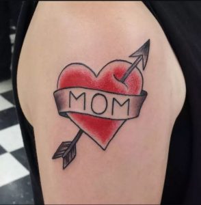 Arm with "Mom" tattoo