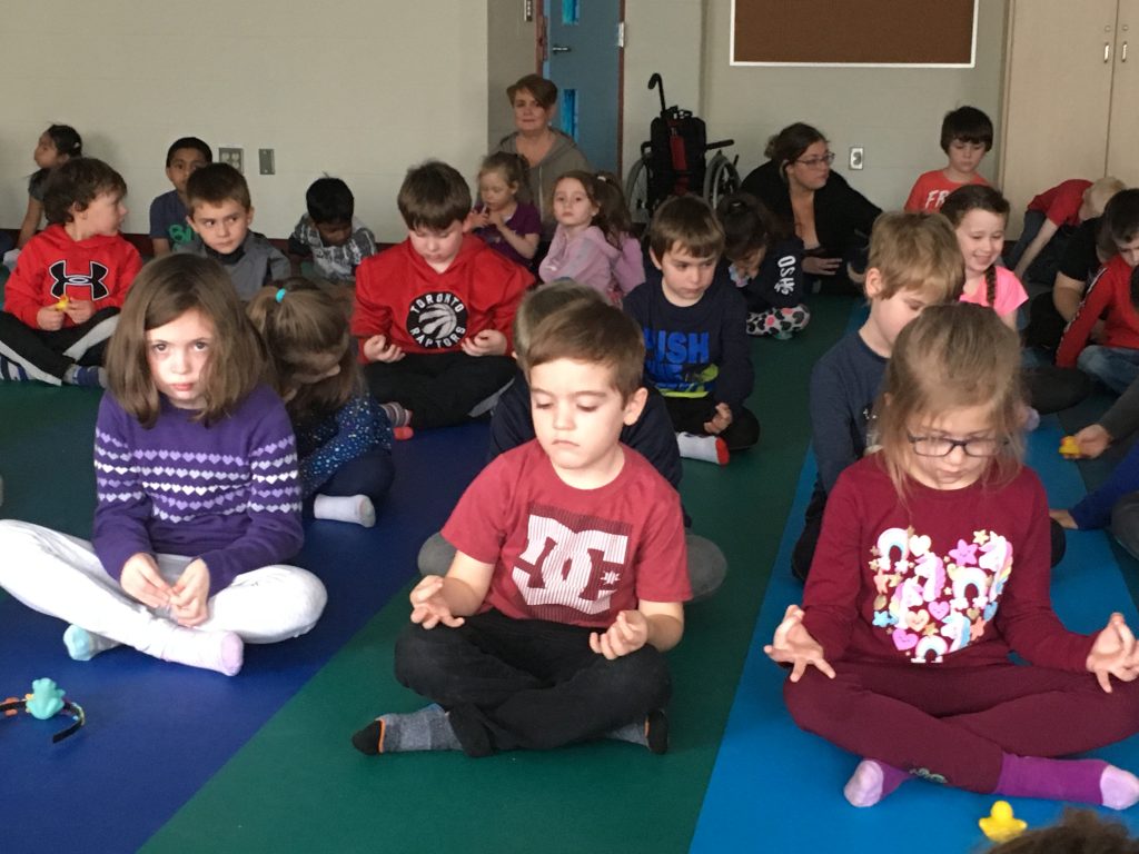Children doing yoga.