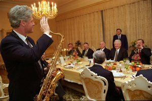 US President Bill Clinton playing saxophone at dinner hosted by Russian President Boris Yeltsin, 1994.