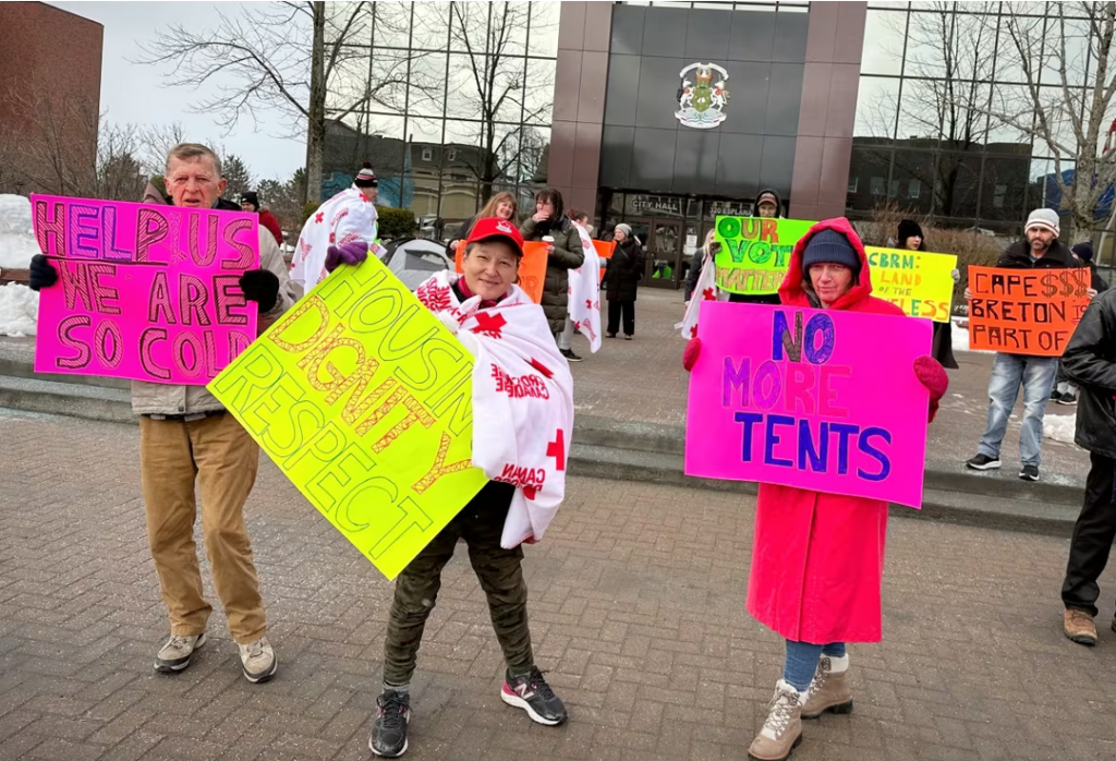 A photo of protestors in front of CBRM Civic Centre, 10 March 2023.