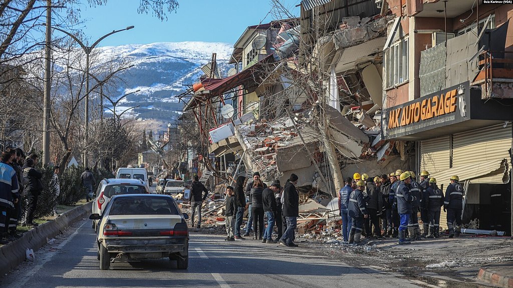 A photo of crumpled buildings following an earthquake.
